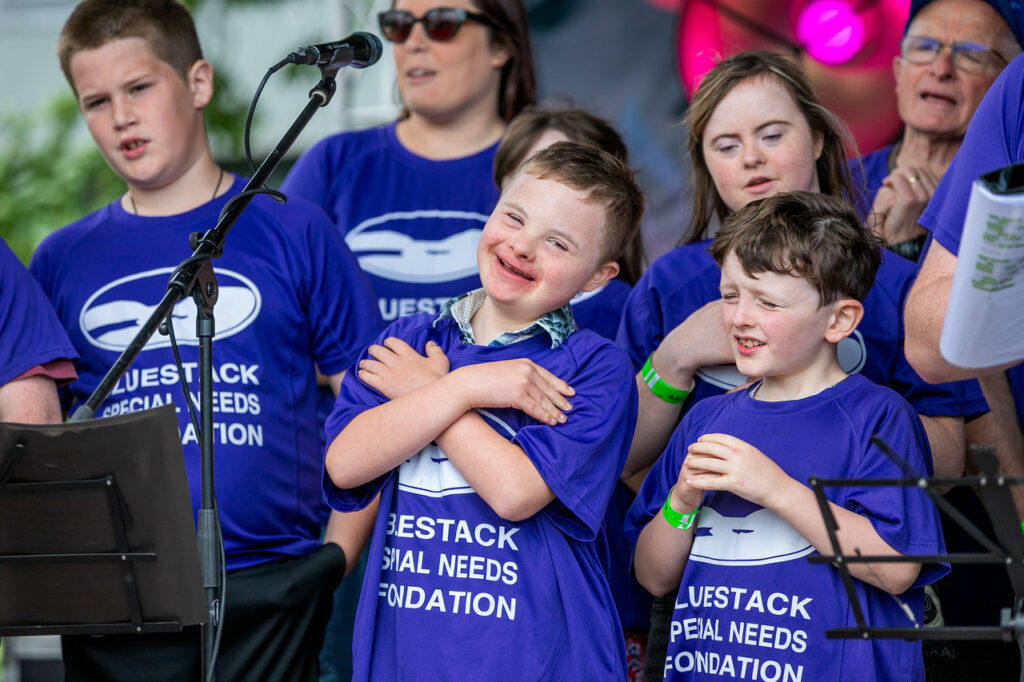 A group of kids performing on stage at Ablefest