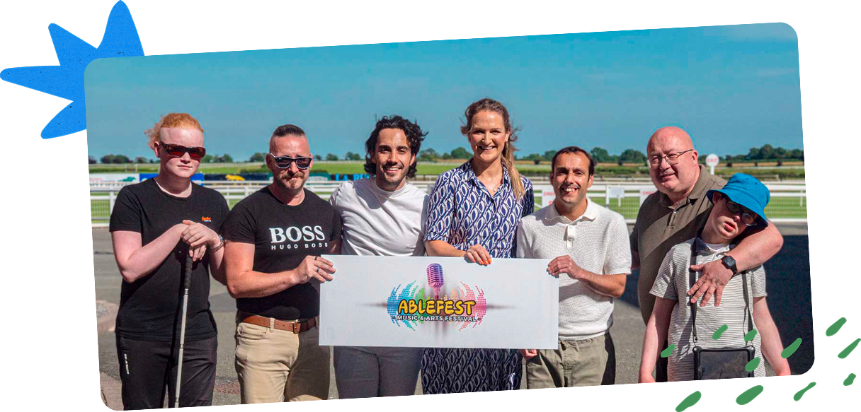 Photo of the Able Fest founding team together with members of their families and community